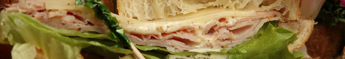 Eating Deli Sandwich at Muheisen's Bagel & Deli restaurant in Washington, NJ.
